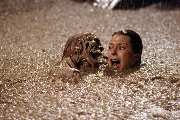 Poltergeist (1982): The production crew used real human skeletons in the pool because they were cheaper to purchase than plastic ones. JoBeth Williams was hesitant about shooting the swimming pool scene because of the large amount of electrical equipment positioned over and around the pool. In order to comfort her, Steven Spielberg crawled in the pool with her to shoot the screen. Spielberg told her, “Now if a light falls in, we will both fry.” The strategy worked and Williams got in the pool.