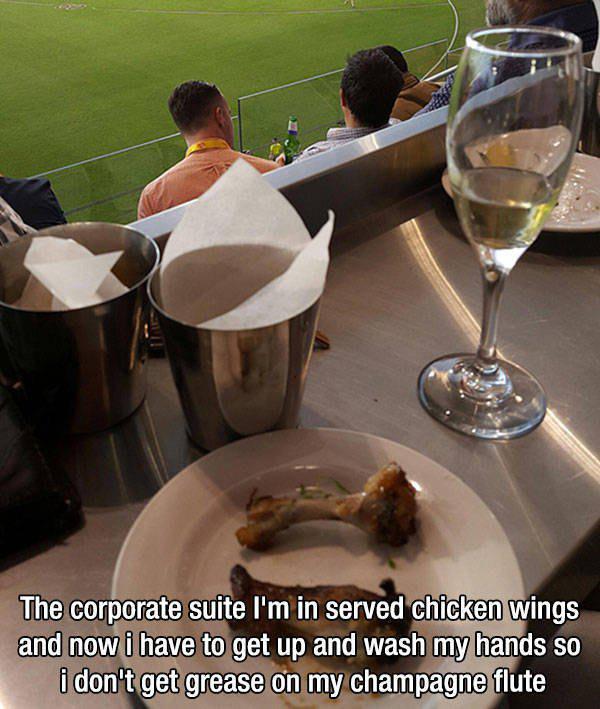 food - The corporate suite I'm in served chicken wings and now i have to get up and wash my hands so i don't get grease on my champagne flute