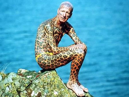 Tom Leppard: The Leopard Man: Formerly considered by the Guinness Book of World Records to be the world's most tattooed man, Tom Leppard, now 73 years old, fled society years ago after spending £5,500 to have his body covered in leopard-like spots. He lived in a small cabin on the Isle of Skye, Scotland. Once every week, the ex-soldier travelled by canoe to buy supplies and pick up his pension. However, in 2008 he moved into a small house on Skye after a friend offered to move him by boat. "I'm getting too old for that kind of life," he said.