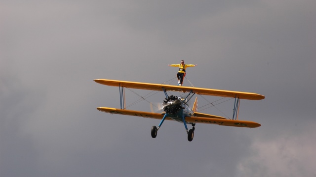 Todd Green was a wing walker who was performing at the 2011 Selfridge Air Show in Michigan. His stunt would have him walk on the wings of a biplane then grab onto the skids of a helicopter. He did not execute the second step and lost his balance, tumbled off the wing and fell to his death.
