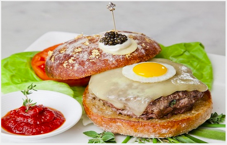 Le Burger Extravagant – $295: NYC is the home of expensive burgers, and you can find this one at Serendipity 3. This used to hold the world record for the most expensive burger, but now it sits at eighth on this list. It’s got the usuals – Wagyu beef, truffles and caviar – but also holds a fried quail’s egg and some creme fraiche. The bun is dusted with gold and it’s served with a diamond encrusted toothpick, just because.