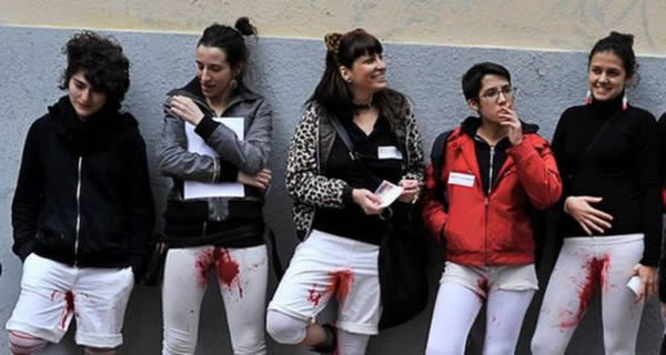 In 2014, tired of feeling ashamed and ostracized by society for their periods, a group of Spanish female performance artists made a public statement by wearing white pants covered with blood stains. 

The street performance, titled “Sangre Menstrual" (literally translated as “menstrual blood”), is a protest against the “patriarchal systems” that oppress women during menstruation. Menstruating women have been viewed as unclean since biblical times. The group aims to “reclaim the female body and free normal bodily functions from shame and judgement."

A statement from the “Manifesto for the Visibility of the Period” read, “I stain [my pants], and it doesn't make me sick. I stain [my pants] and I don't find it disgusting." The performance created “ a larger debate surrounding reproduction and the female body," and has represented the “body as a political act of defiance."