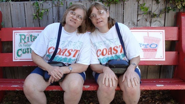 Flo and Kay Lyman are identical twins who are autistic and have special savant abilities. The sisters, now in their late 50s, have been dubbed "The Rainman Twins." They demonstrate an extraordinary ability to calculate dates and retain a vast collection of details about seemingly everything that has happened to them in their entire lives. They can remember everything about what they have seen, heard, tasted, smelled, and touched.

Flo and Kay are the only known autistic savant twins in the world. While it is certainly special to be an autistic savant, what makes the two women even more unique is how they are not stereotypically autistic. They are social, talkative, outgoing and bubbly. They are comfortable with making jokes and expressing opinions. They also enjoy going out to see live bands.

Just like Dustin Hoffman's Rain Man character religiously watched and took notes on every episode of The People's Court, so did the Lyman sisters with The $100,000 Pyramid and all its permutations. They kept carefully coded charts on the game, marking down every clue used, every mistake buzzed, and every color of suit worn by their idol, Dick Clark. Their brother-in-law once observed: “They need food, they need air, and they need Dick Clark.” 

Flo and Kay were devastated when Clark had a stroke in 2004—they formed a small shrine in their bedroom, and prayed regularly for his recovery.