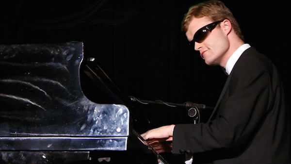 Derek Paravicini is 36, blind, has severe learning difficulties and cannot dress or feed himself, but play him a song once, and he will not only memorize it instantly, but he'll be able to reproduce it exactly on the piano.

He was born prematurely, at 25 weeks. His blindness was caused by oxygen therapy given during his time in a neonatal intensive care unit. The therapy also affected his developing brain, resulting in his severe learning disability. However, he is a musical prodigy. He has perfect pitch and the ability to play almost any piece of music after hearing it only once. Consequently, he has memorized countless musical compositions, and can play any of them on demand in any style.

Paravicini's obsession with music began when his nanny gave him a toy keyboard to play with when he was just a toddler. On his very first visit to The Linden Lodge School for the Blind, he heard music and followed the sound to a room where a teacher, Adam Ockelford, was playing the piano. He pushed Ockelford to one side and took over, playing with his fingers, the backs of his hands, his elbows, and even his nose. Ockelford encouraged his obvious musical interest and ability and started to give him lessons—first weekly and then daily—once he realized the boy's talent and hunger for music.

Since then, Paravicini has played live shows from Las Vegas to Buckingham Palace, thrilling audiences worldwide. He has been the subject of countless documentaries and an official biography, In the Key of Genius, written by his teacher, Adam Ockelford.
