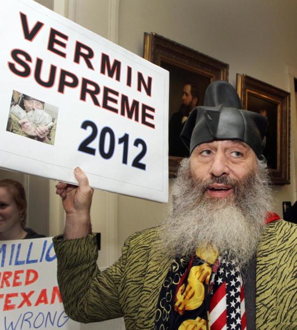 Vermin Supreme has been described as a "satirist", "anarchist", and or "performance artist." He campaigned as a Democrat in 2012 and is doing so again in 2016. He hopes to fight our "moral and oral decay" by promising a free pony to every American if elected. He says, "It will create lots and lots of jobs once we switch over to a pony based economy." Vermin also wants to harness "the awesome power of zombies for energy sources" by dangling brains in front of zombies to lure them into turning turbines. 

Supreme calls himself a "friendly fascist." In 2012, he reportedly challenged Texas Congressman Ron Paul to take on President Obama in a "panty-wrestling match to decide it all." 

It's too soon to tell what he's got up his sleeve for 2016, but he has already embarked on a tour of 20 cities to build support for his campaign. He is currently seeking to qualify for matching funds from the Federal Election Commission (FEC).