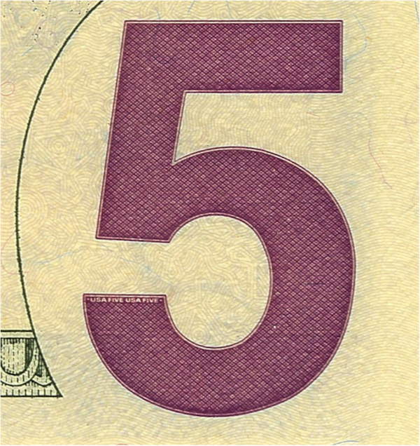 On the edge of the purple five located on the back of the bill you can see “USA FIVE” printed twice.