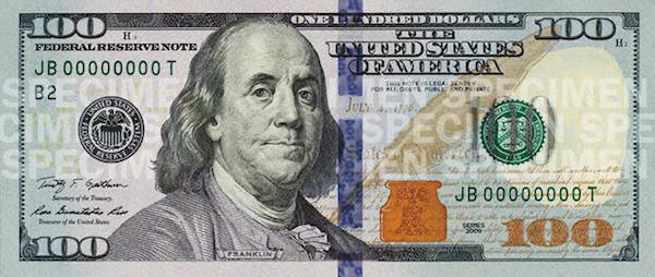 In order to protect the $100 bill from being counterfeited, high resolution images are hard to come by, But, there is plenty of stuff hidden on these bills as well.
“THE UNITED STATES OF AMERICA” can be found along Franklin’s collar, “100” is repeated all along the borders of the bill, and You can find “ONE HUNDRED USA” along the edge of the golden quill.