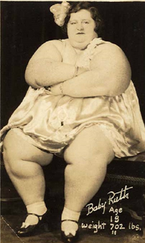 Ruth Smith-Pontico was born in 1904 in Kempton, Indiana. She weighed a whopping 16 pounds. As an adult, she would become the third generation of women in her family to be featured as "The World's Fattest Lady" in sideshows. 

Baby Ruth made an excellent income from being featured, and her devotion to fulfilling her role was intense. She was determined to meet the demands of the crowd and reportedly gained up to 40 pounds a year to keep up appearances. 

After nearly a decade of performing with Ringling Bros. and Barnum & Bailey Circus, the 700-pound beauty was admitted to a hospital in Florida to have fatty tumors removed from her legs. It was known to be a pretty standard procedure, but things took a turn for the worse during the recovery phase. As Ruth was coming out from under the effects of the anesthesia, she began violently vomiting. The medical team responsible for her care frantically tried to sit her in an upright position but were unable to do so because of her size. She choked to death in 1942, leaving behind a husband and daughter.