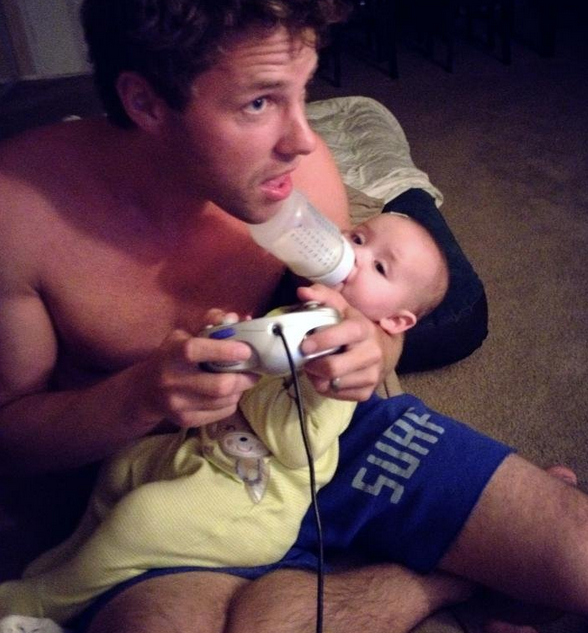 dad gaming with baby - Surf
