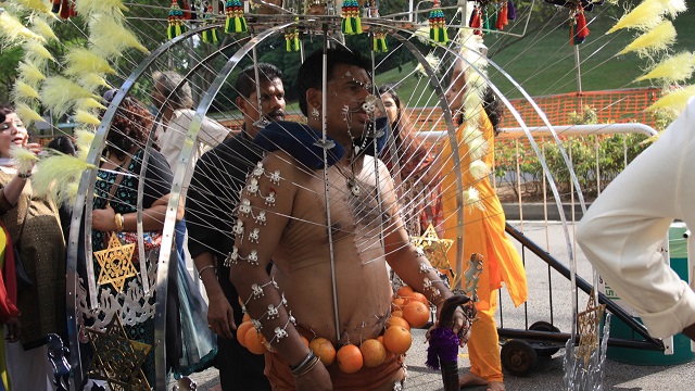 Tamil Hindus celebrate the Thaipusam festival by piercing themselves. The festival celebrates the Hindu Goddess of love, Parvati, giving Murugan, the Hindu God of war spear to vanquish a demon, so devotees celebrate by either carrying burdens on a pilgrimage or piercing their bodies. The piercings have become pretty elaborate over the years as devotees compete to show their devoutness, and often more burdens are hung from hooks in the flesh (as can be seen around this man's waist).