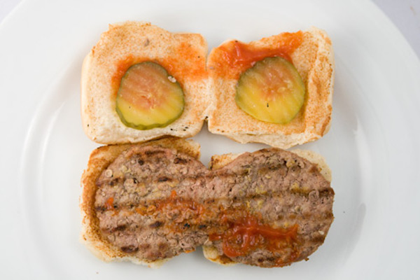 In 1987, Burger King decided it wanted to be the ruler of tiny burgers. Burger Bundles came in packs of 3 or 6. These babies were marketed to preteens, but because they were too small for the broiler machines, they ended up falling through the cracks. In 1989, the company revolutionized the burger by smashing two patties together and rolling them through the broiler. However, after poor sales, Burger King threw in the towel on Burger Bundles. 

In 2004, the King tried again with Burger Shots, but like their miniature predecessors, they were introduced and quickly forgotten. White Castle remains king of the tiny burger—on January 14, 2014, Time magazine labeled their slider the most influential burger of all time.