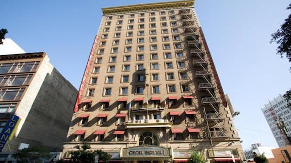 Gentrification may not be able save LA's Cecil Hotel, now known as Stay On Main. It has such a sordid past that show creator Ryan Murphy has admitted the place is the inspiration for American Horror Story: Hotel. He said, "There was a surveillance video that went around that showed a girl getting into an elevator in a hotel that was said to be haunted—and she was never seen again."

The video he's referring to features Canadian tourist Elisa Lam, 21, whose nude body was found in the Cecil's rooftop water tank in 2013 after complaints from tenants about strange, dark water which tasted "sweetly disgusting." (The source of this "funny" taste was found to be Lam's decomposing body, which had been in the tank for two whole weeks.)

The mystery of what happened to Lam only deepened when the video in the hotel elevator was released. The frightened, curious and highly disoriented girl appears to believe she is being followed by something or someone. (See it below, and yes, it is disturbing.)

The Cecil opened in 1924 to great fanfare in what was then a cutting-edge area of downtown LA. But five years later, when the stock market crashed in 1929, a depression settled over the Cecil that would never leave. The surrounding neighborhood slowly fell into disarray, and the hotel increasingly became a hostel for the shady and the sick. For the following eight decades, the Cecil would be marred by suicides to such a degree that long term residents began to refer to the building as "The Suicide."

By the 1970s and '80s, Skid Row (the area surrounding the hotel) was plagued by increasing violence and a huge influx of illegal drugs. Richard Ramirez, the infamous "Night Stalker" who terrorized LA in the mid-1980s, allegedly lived at the Cecil, where rooms were as cheap as $14 a night. Ramirez wasn't the only murderer who would call the Cecil home. Austrian serial killer Jack Unterweger also stayed there in the early '90s. 

In 2007, the Cecil was purchased for $26 million and turned into a budget boutique hotel for hip, middle-class tourists. However, despite the hotel's partial transformation (there are 328 rooms that are still vacant), the weirdness continues. As recently as June 2015, a 28-year-old man was found dead outside the Cecil after an apparent fall. It seems the curse of the hotel lives on.