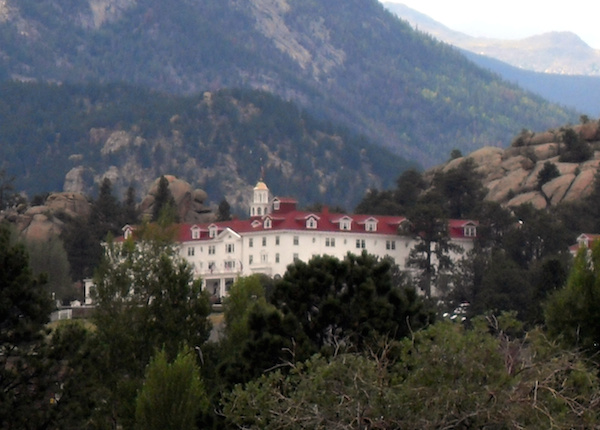 The Stanley Hotel, located in Estes Park, Colorado, a resort town just east of Rocky Mountain National Park, has earned its spirit-laden reputation over the last century.

The Stanley was opened in 1909 by a Massachusetts couple, F.O., and Flora Stanley, as a secluded mountain resort. Though the Stanleys have passed, many believe they never actually left. Mr. Stanley has been reported as hovering behind employees at the reception desk, and Mrs. Stanley can still be heard playing piano in the hotel's music room.

Haunted events have been recorded at the hotel as far back as 1911, when Elizabeth Wilson, a housekeeper, was electrocuted during a lightening storm. Though she wasn't killed, the room where it happened, Room 217, has become a hotbed of paranormal activity. Strange, unexplained occurrences are said to take place in that room, including doors opening and closing, and lights switching on and off by themselves.

Stephen King spent the night in Room 217 in the mid-70s. While we don't know exactly what he witnessed there, he did write The Shining after staying at the Stanley, and Room 217 factors heavily in the story.

Numerous television shows having to do with the paranormal have filmed there, and every year, thousands of believers (and skeptics) converge on the property to decide for themselves if the place is really haunted. 

Resident paranormal investigator Lisa Nyhart leads guests on ghosts hunts and rarely comes up empty handed. "We have more nights with activity than [without]," she says. "It's a Disneyland for spirits."