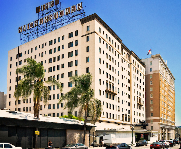 The Knickerbocker has a macabre history that rivals that of any hotel on this list. Formerly one of the hippest spots in Hollywood, the hotel was home to celebrities and aristocrats alike immediately following its opening in July 1929. The luxe Spanish-Colonial building and its nightclub, the Lido Room, became a hotspot for the burgeoning film community.

In 1936, the "creepy" factor came to the hotel and never really left. Before he passed away, magician Harry Houdini had told wife Bess that if he died, and there was an afterlife, he would come back to her to prove it once and for all. For ten years, Bess had been holding a séance every Halloween, waiting for Harry to give her a sign. Her last attempt was on the roof of the Knickerbocker. It was a media sensation and cemented the hotel's legendary status, but Harry never revealed himself. 

In 1943, mentally troubled film star Frances Farmer, wearing only a shower curtain and screaming obscenities, was dragged through the hotel lobby by police and was eventually placed in a mental institution. Five years later, D.W. Griffith, the pioneer silent film director, walked into the lobby and fell dead from a cerebral hemorrhage. 

In 1962, MGM costume designer Irene Gibbons slashed at her wrists, then leaped to her death from the 11th floor. Her body landed on the roof of the hotel lobby.

The body count doesn't end there. William Frawley, best known as Fred Mertz on I Love Lucy, walked out of the hotel's bar—where he always ordered a walnut with his drink—and dropped dead on the sidewalk in 1966.

By the time Frawley died, the Knickerbocker had become something of a dump. Gangs, prostitutes, and drugs slowly drained the charm from the grand old hotel. In 1970, it was renovated and converted into apartments for senior citizens.