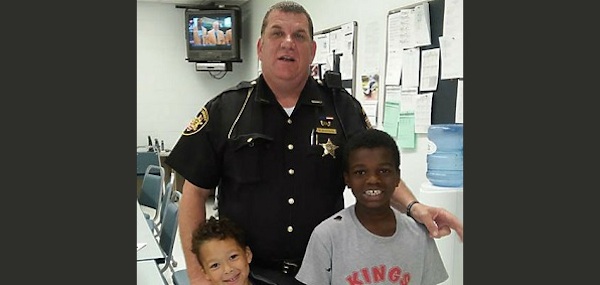 Butler County, Ohio Sheriff's Deputy Brian Bussell is being hailed as a hero after he gave a homeless family shelter, clothing, shoes, and food.

Bussell went out of his way to help a mother and her two sons after he spotted them sitting a particularly long time in a jail waiting room. When he asked if something was wrong the mother of two, Tierra Gray, told the officer that she had been evicted from her home. 

Bussell called several shelters to try and find the family housing, but most of the shelters were already overcrowded. He proceeded to put the family up in a hotel for ten days and take them to a nearby Walmart where he bought them essentials—all out of his own pocket.

Bussell did not tell anyone at work of his good deed. “This is a true act of kindness,” said Butler County Sheriff Richard K. Jones. “He did not tell anyone at work what he had done, but the lady took a picture with him and posted it on Facebook. That's how we found out.”