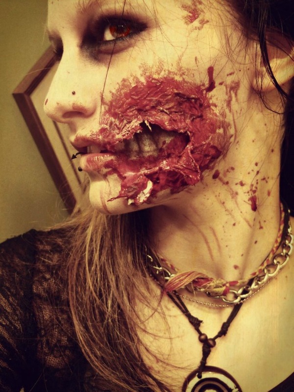 There is plenty of zombie makeup out there, but this look by Cathleen Marie O'Brien is particularly impressive with teeth that show right through the flesh.