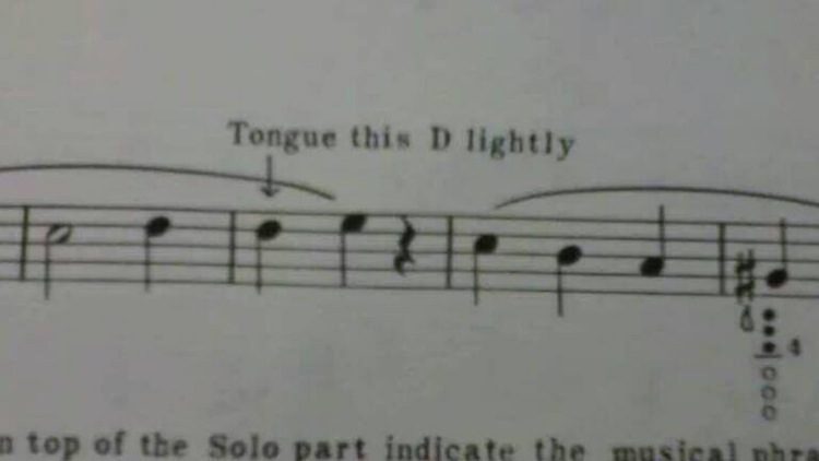 tongue this d lightly music - Tongue this D lightly top of the Solo part indicate the