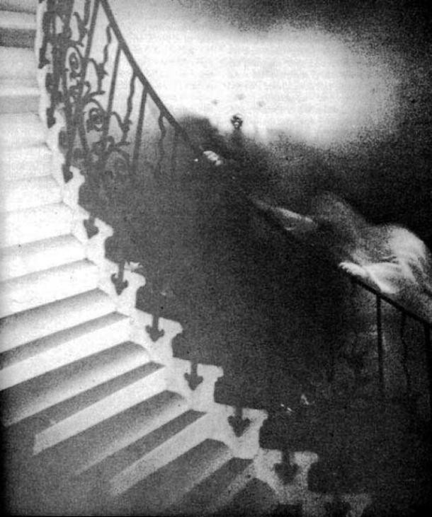 Rev. Ralph Hardy, a retired clergyman from White Rock, British Columbia, took this famous photograph in 1966. Originally, he only wanted take a picture of the elegant Tulip Staircase in the Queen’s House section of the National Maritime Museum in Greenwich, England. Upon development, however, the photo revealed a shrouded figure climbing the stairs. Experts who examined the original negative concluded that it had not been tampered with. The vicinity of the staircase is rumored to be haunted and unexplained footsteps have often been heard there.
