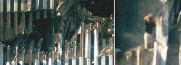 In this picture, a woman is standing on the edge of the demolished South Tower as it was hit by an airplane in the 9/11 terrorist attack. Waving and probably calling for help, the woman obviously survived the initial attack but it is unclear how she made it or what happened to her after.