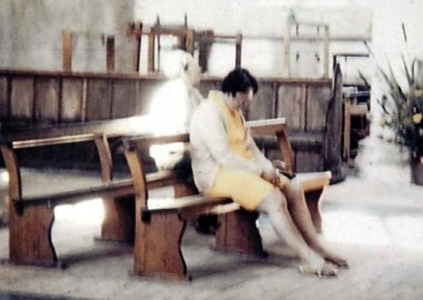 In 1975, Diane and Peter Berthelot visited the Worstead Church in north Norfolk, U.K. While in the church, Peter took a photo of his wife sitting and praying on one of the church benches but when they developed the film, they found out there was a bizarre ghostly figure sitting right behind Diane. When they got back to the church, a local vicar told them it was the White Lady, the ghost of a healer who was believed to haunt the church.
