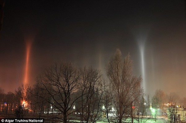 The above image shows mysterious columns of light streaming into the sky above the town of Sigulda in Latvia at the end of December 2008. 

Proof of alien existence? No—experts agreed there's a more prosaic explanation—ice crystals in the air.

At the time (and during an unusually cold winter) the air above the town was filled with suspended ice crystals. It is believed that the columns were formed by those reflecting light from the bright street lamps and other lights on the ground and beaming it back down again. Still, scientists at spaceweather.com said the pillars are not ordinary. A leading expert in atmospheric optics said, "These pillars are mysterious. They have unexplained curved tops and even curved arcs coming from their base. Arcs in rare displays like these could be from column crystals to give parts of tangent arcs; others could be the enigmatic Moilanen arc or even the recently discovered reflected Parry arc. We don't really know—so take more photos on cold nights!"