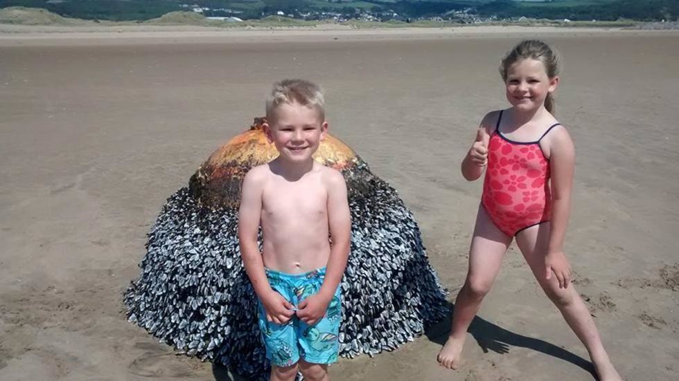 A family's kids thought they were playing with a buoy they found on the beach when it was really an unexploded bomb from World War II.