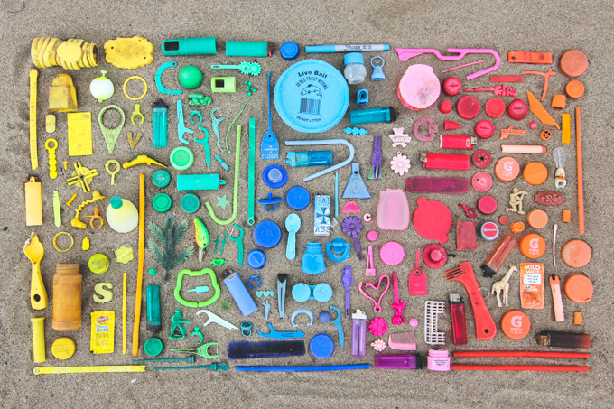 A colorful array of various items found and organized neatly by Kayla from a beach in Cleveland, Ohio.