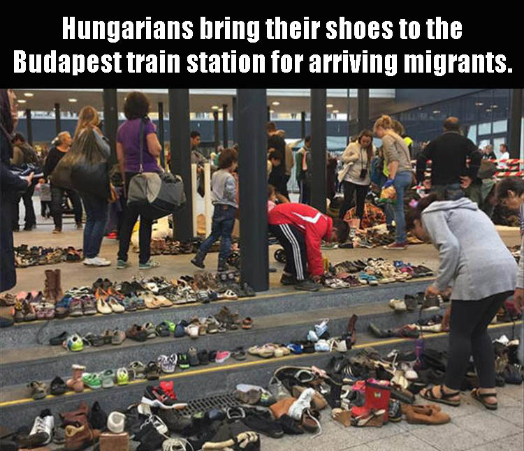 Hungarians bring their shoes to the Budapest train station for arriving migrants.
