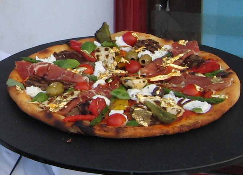 Chef Domenico Crolla from Glasgow, Scotland made a pizza worthy of James Bond. His creation "Pizza Royale 007" is the most expensive Italian pie. The $4,200 concoction comes with toppings like champagne-soaked caviar, smoked salmon, and lobster marinated in Cognac. The final topping is 24-karat gold flakes.
