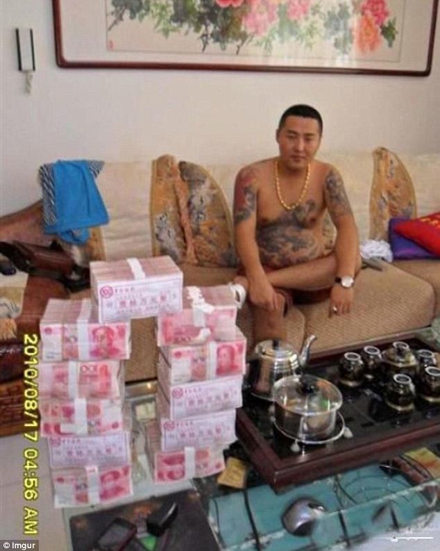 "Photos found on lost phone of 'Chinese gangster' show his bad-boy lifestyle."