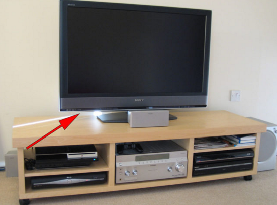 The USB port on the back of most TVs can be used to charge your phone if you're traveling.