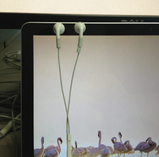 Apple earbuds will magnetically stick to a MacBook's screen so you don't lose them.