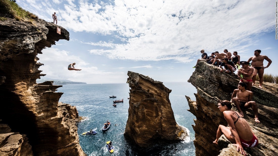 Enter Red Bull's Cliff Diving World Series in Azores, Portugal and jump off a 88-foot stone into the water.