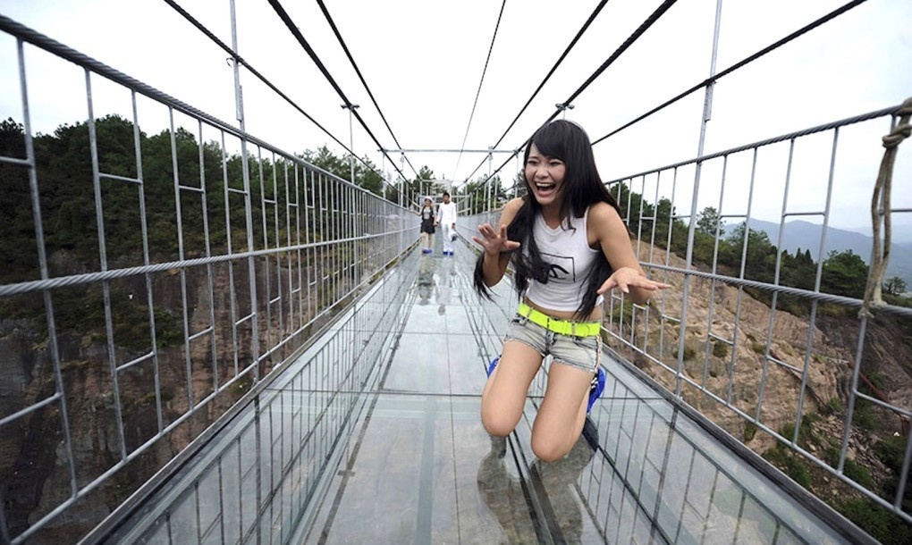 Take a walk down the world's longest glass bottomed bridge between the two peaks of Stone Buddha Mountain in Hunan.