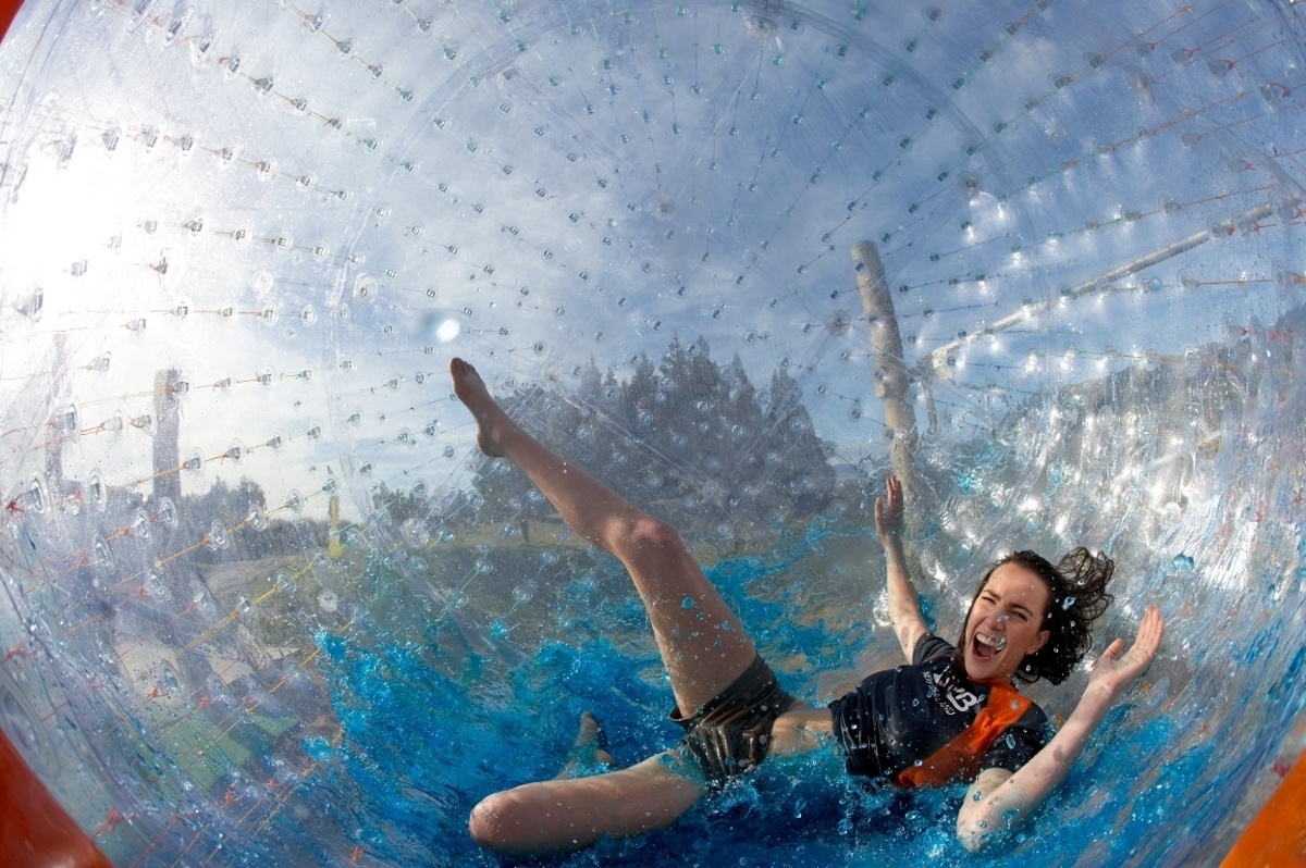 Roll down a hill in New Zealand in a giant clear inflatable orb (zorbing).