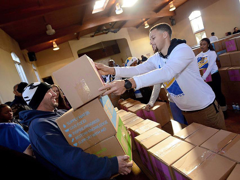 NBA MVP Stephen Curry and his family organized efforts to provide meals for 400 families in need.