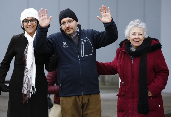 Jason Rezaian, one of the U.S. citizens recently released from detention in Iran, waves as he arrives in Germany for medical treatment.