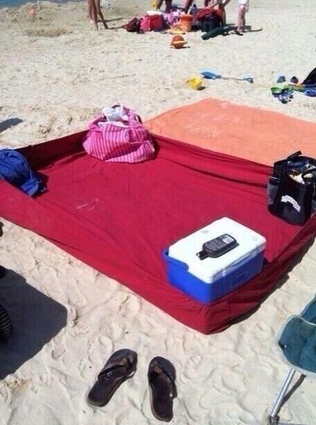 When going to the beach, bring a fitted bed sheet to prevent sand getting onto your beach blanket or towel
