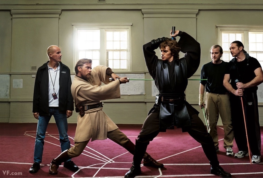 Ewan McGregor and Hayden Christensen practicing their Jedi moves with their light sabers.