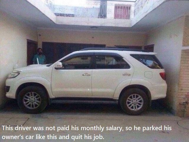 car stuck between two walls - This driver was not paid his monthly salary, so he parked his owner's car this and quit his job.