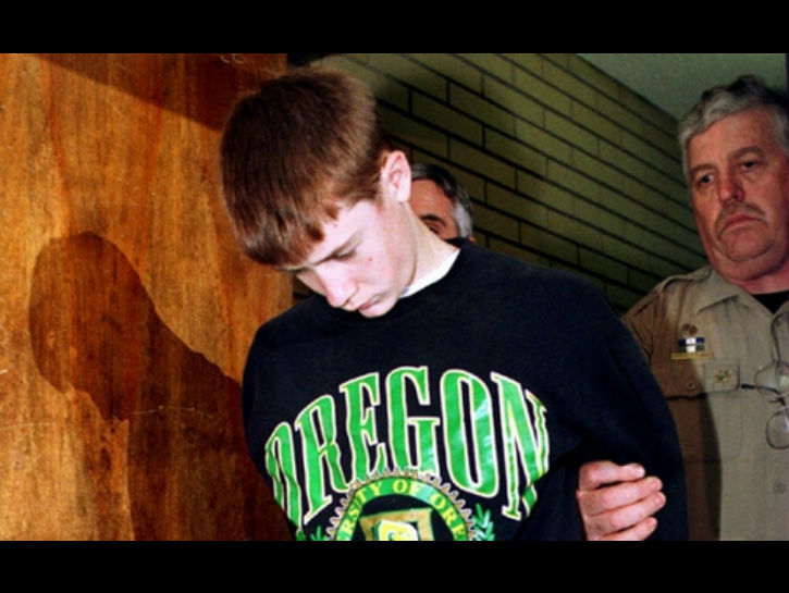 At age 15, Kipland Kinkel was expelled for bringing a gun to school. He returned to school the next day with a rifle and opened fire in the cafeteria. He killed two students and injured 25 others. He then tried to attack the police with a knife, telling them he wanted to die.

When the authorities raided his house, they found both his parents at the house, dead. He had shot them in the head and the house was rigged with explosives. Apparently, the son and his father started arguing after his father said he would send him to military school if he didn’t start behaving better.

They also found a note on the kitchen table which said “My head just doesn’t work right. God damn these voices in my head… I have to kill people.”

Kinkel is currently serving a 111-year sentence with no chance of parole.