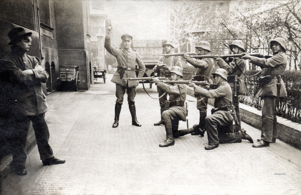 A German Communist holds his head high as he faces a firing squad in Munich, 1919.