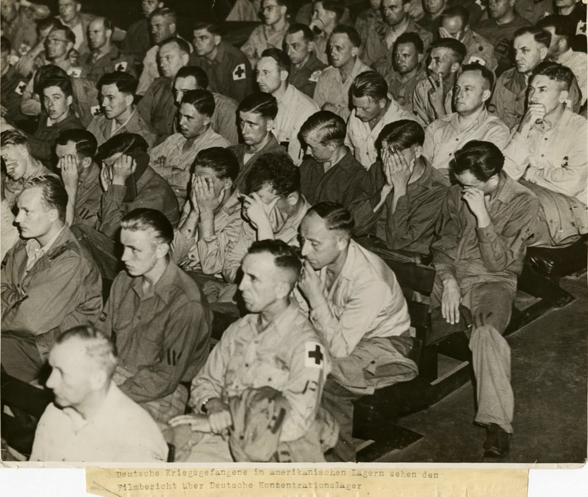 German prisoners of war react to watching film footage from concentration camps, 1945.