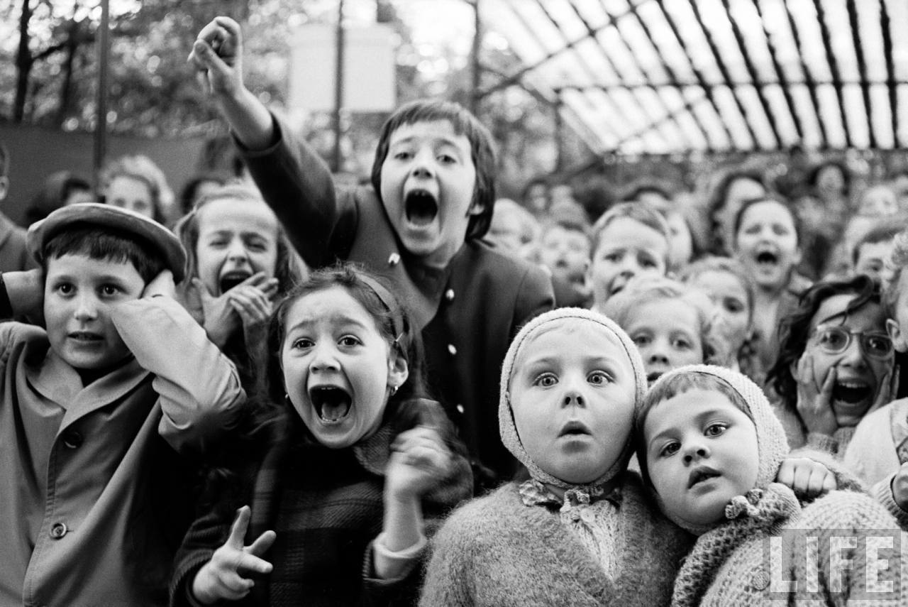 Children are overcome by emotion during a puppet show in Paris, 1963.