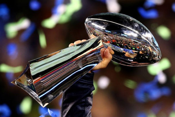 The Lombardi Trophy, given to the winning Super Bowl team, weighs seven pounds, is twenty-one inches high, and worth $25,000. Vince Lombardi was the coach of the Green Bay Packers, who won the first Super Bowl in 1967.