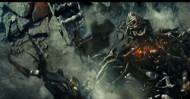 Transformers: In the final battle of the movie, after Bumblebee loses his legs, look at the tow truck Mikaela Banes starts to hot-wire. The truck is actually Longarm from the video game.