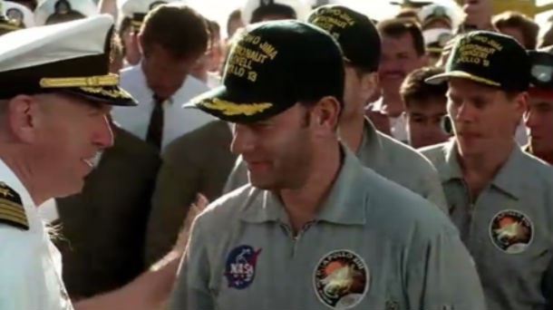 Apollo 13: Jim Lovell, the astronaut portrayed by Tom Hanks, makes a cameo at the end of the film when the astronauts are retrieved from their capsule and brought safely aboard the ship. He was asked by Ron Howard to wear the uniform of a US Navy admiral for his appearance but Lovell said that he would prefer to play the role in his old captain’s uniform because that was the rank he held when he retired from the navy. Hence the “admiral” listed in the film’s credits is only wearing the four bars of a captain on his shoulder boards.