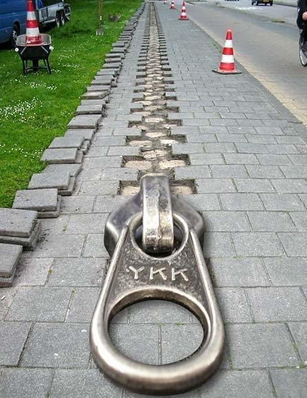 Most of our zipper pull tabs are labeled "YKK," which stands for the Japanese company Yoshida Kogyo Kabushikikaisha.