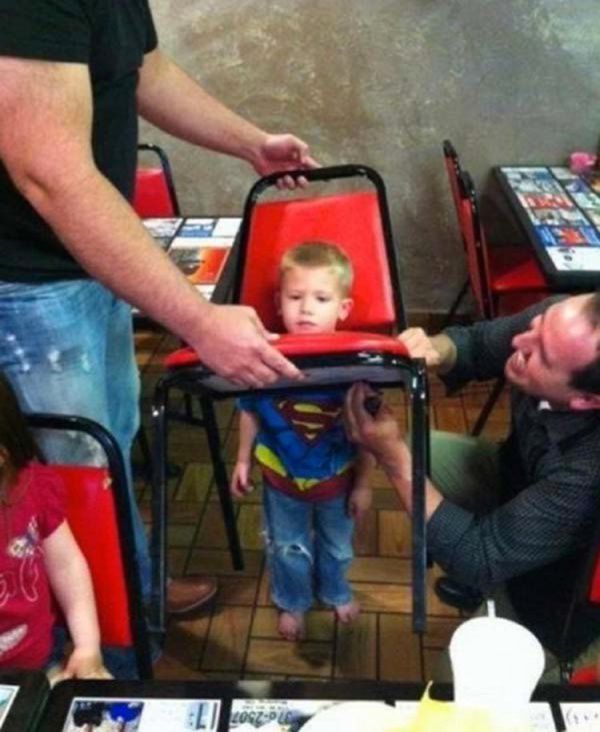 kid ruining things kid with head stuck in chair