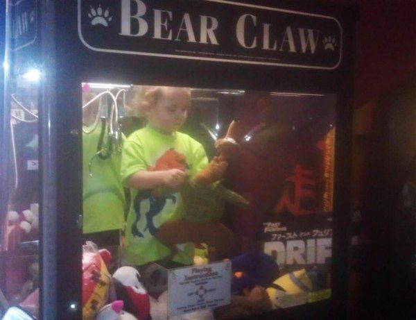 kid ruining things kid in claw machine - Bear Claw